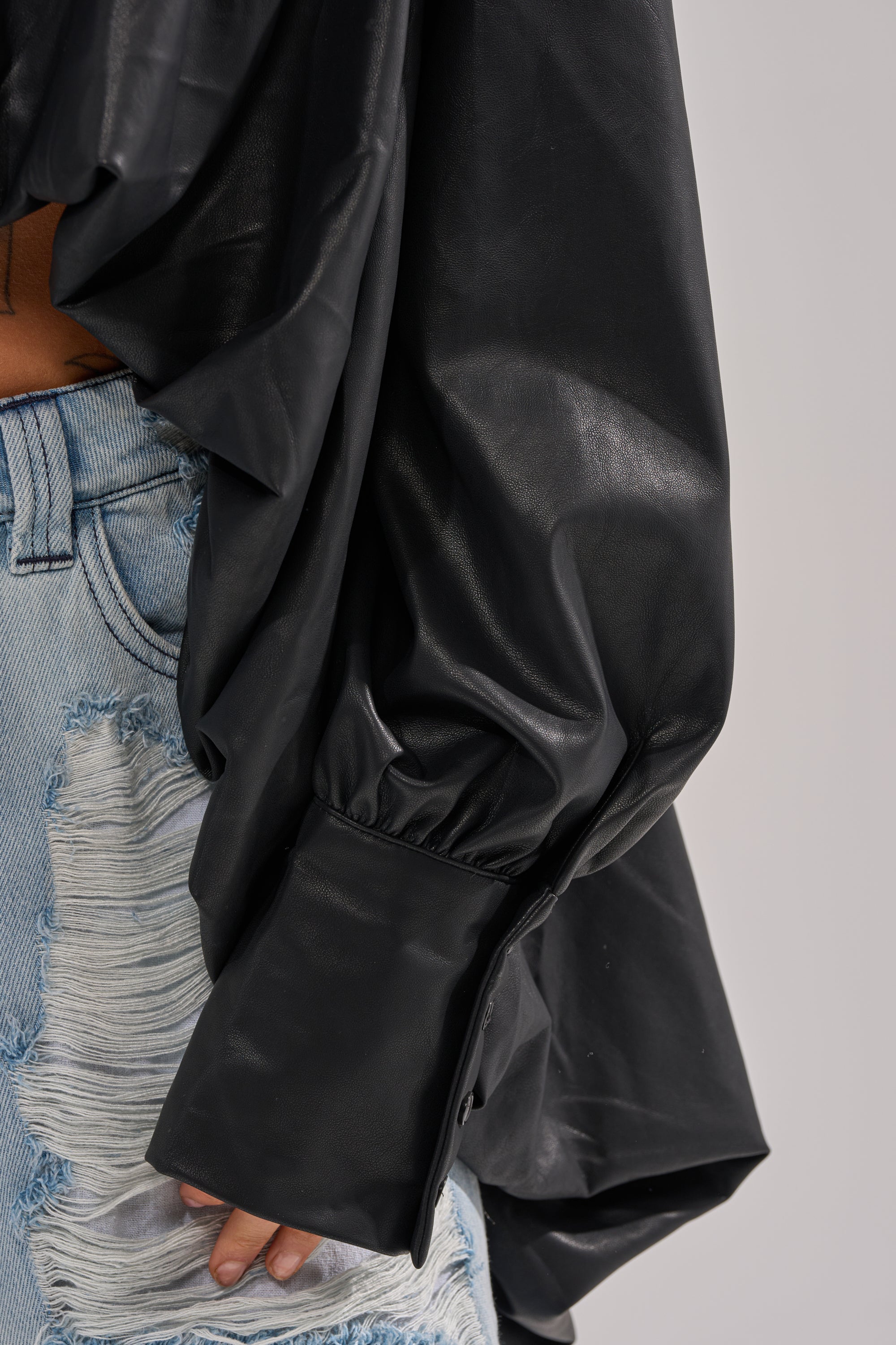 NEW ATTITUDE FAUX LEATHER HI-LOW BLOUSE