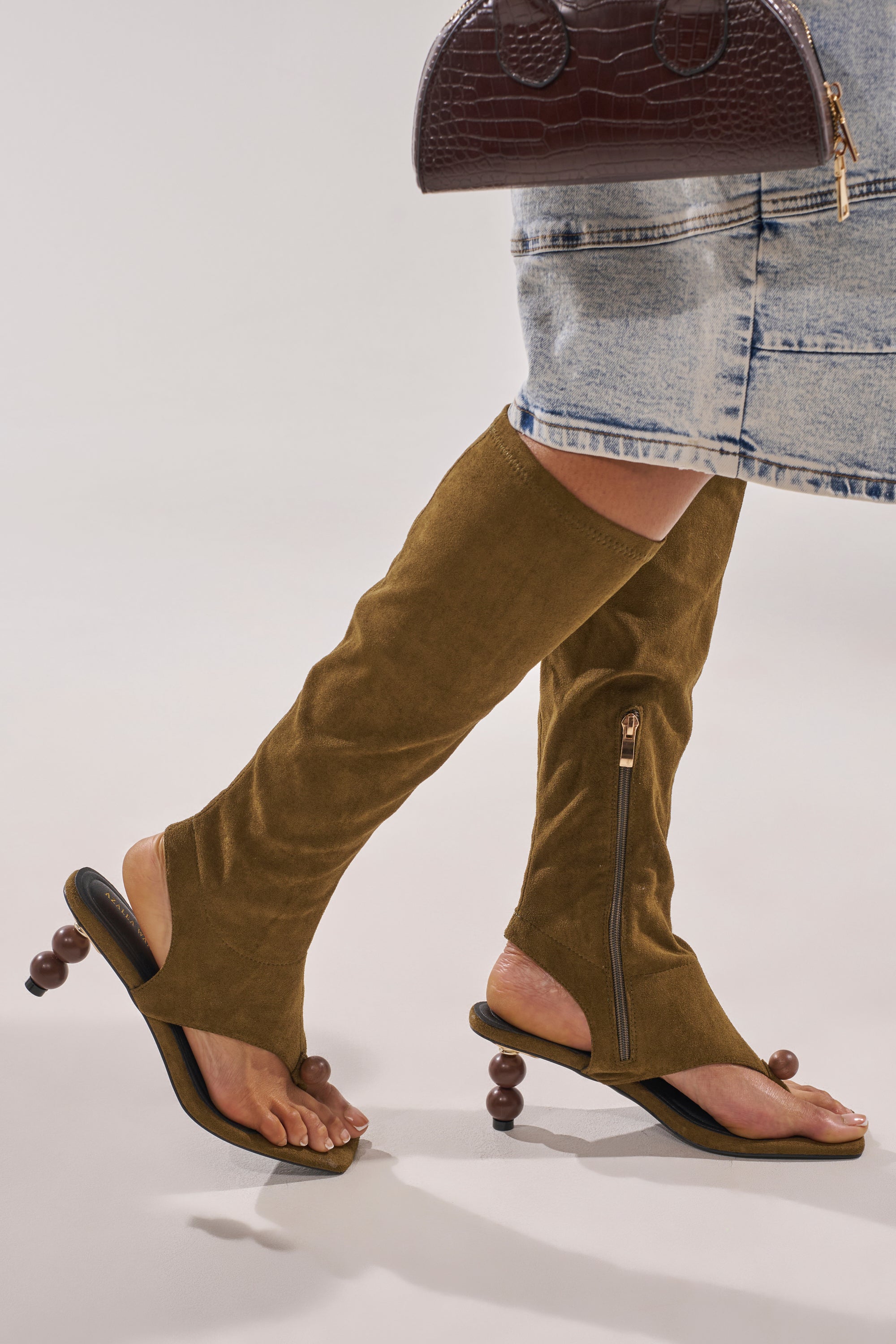 AZALEA WANG DOTTIE OLIVE STRETCH FAUX SUEDE BOOT WITH EMBELLISHED HEEL AND TOE HARDWARE