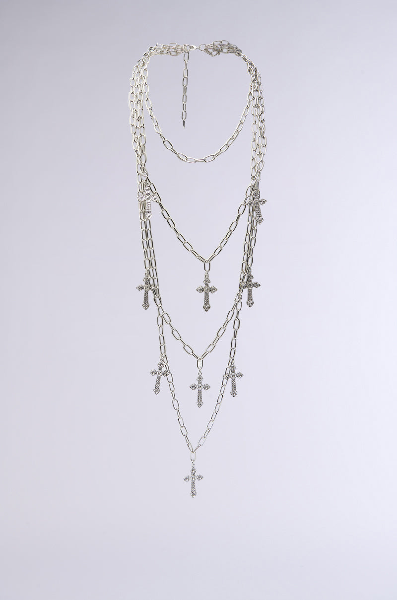LAYERS TO THIS CROSS NECKLACE