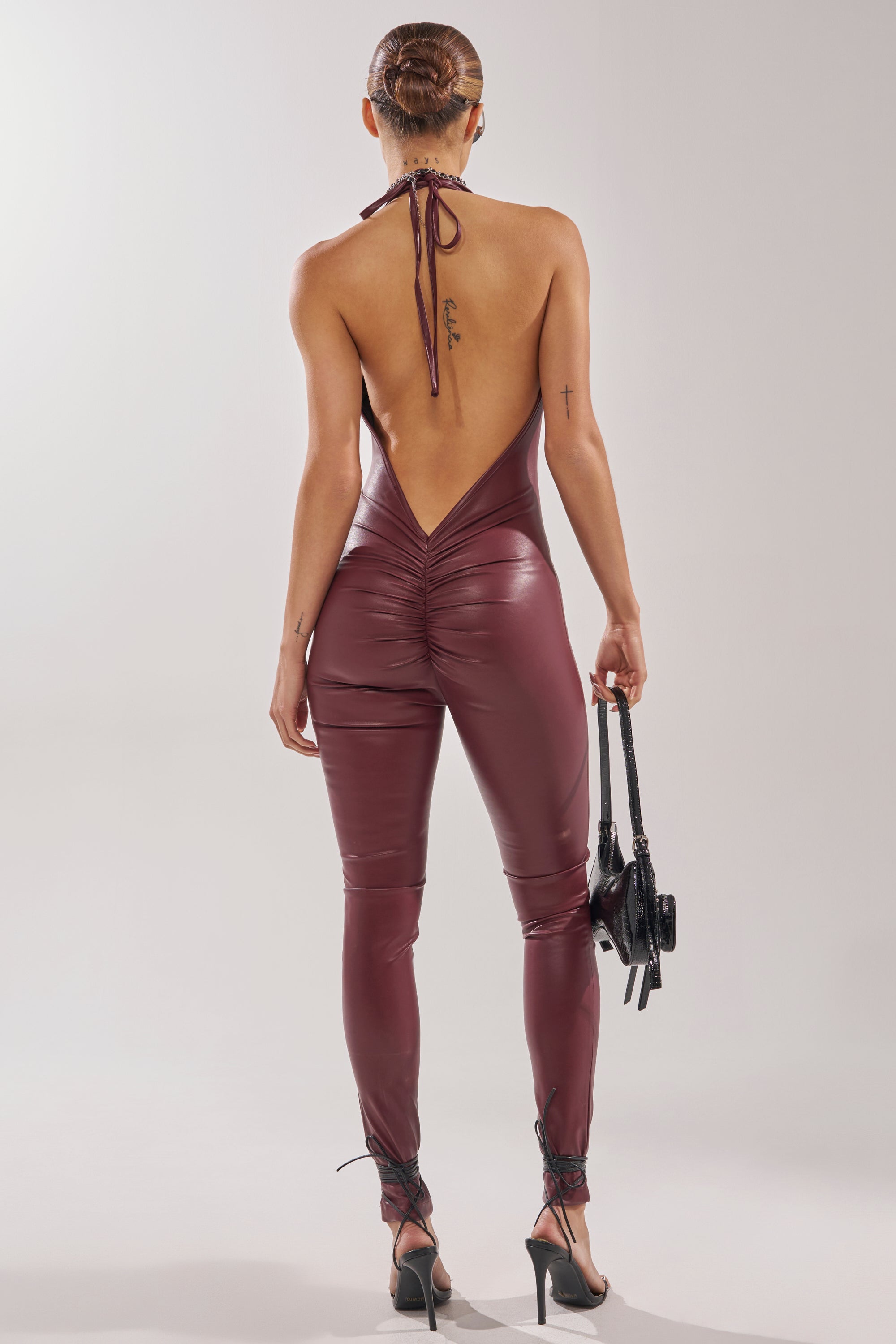 LATE TO THE PARTY LEATHER JUMPSUIT IN BURGUNDY