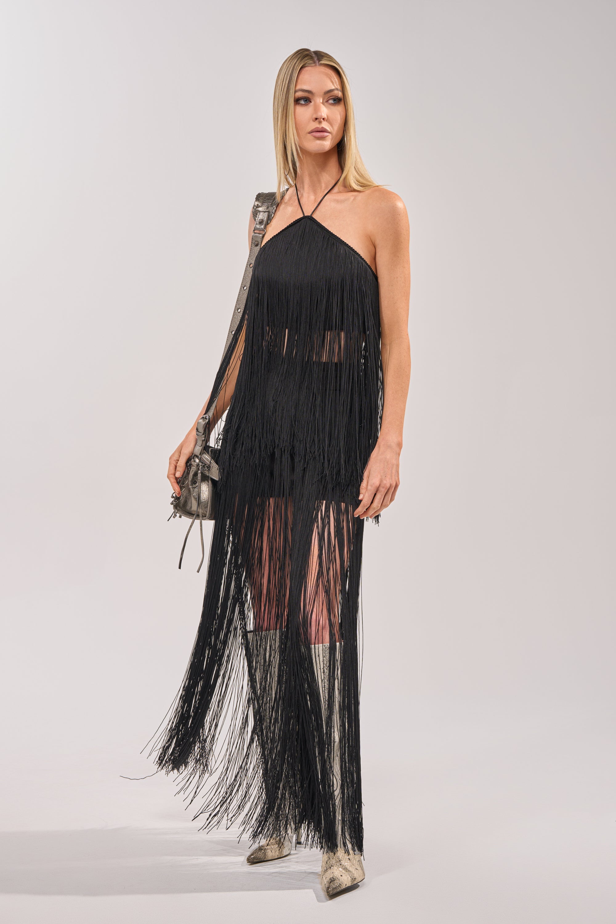 ON THE EDGE FRINGE HALTER TOP IN BLACK